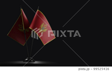 Small national flags of the Montenegro on a black background Small national flags of the Montenegro on a black background 99525416