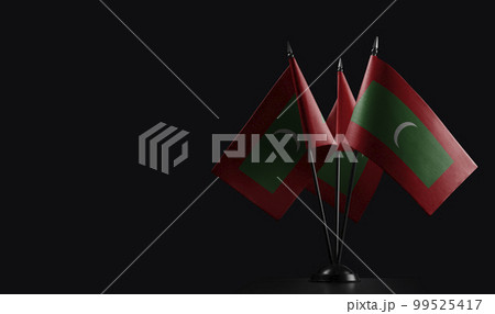 Small national flags of the Maldives on a black background Small national flags of the Maldives on a black background 99525417