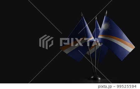Small national flags of the Marshall on a black background 99525594