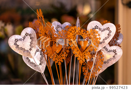 Different flowers and seedlings near the florist flower shop entrance, spring time, easter concept Different flowers and seedlings near the florist flower shop entrance, spring time, easter concept 99527423
