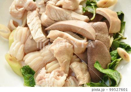 boiled slice pork meat and organ on plate dipping spicy and sour chili sauce  99527601