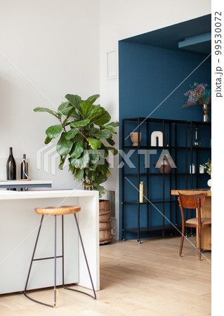 Black metal shelving against a blue wall. Kitchen interior. Black metal shelving against a blue wall. Kitchen interior. 99530072