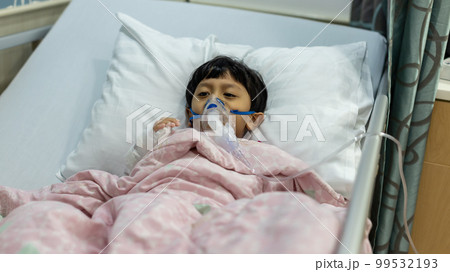 Sick boy inhalation therapy by the mask of inhaler. Sick boy inhalation therapy by the mask of inhaler. 99532193