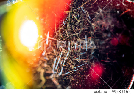 macro of the scratched surface of a polarized sunglasses lens 99533162