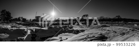 Sioux Falls Park during winter with frozen waterfall and snow cover. 99533226