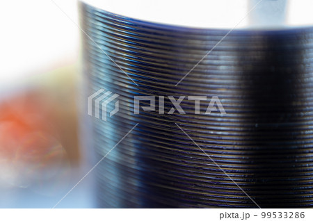 Selective focus on a sleeve of compact discs CD's used for storing electronic media. Selective focus on a sleeve of compact discs CD's used for storing electronic media. 99533286