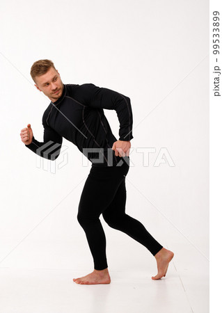 A man with a sporty physique in thermal underwear. A man with a sporty physique in thermal underwear. 99533899