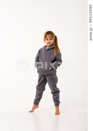 Little girl in thermal clothes, on a white background. Little girl in thermal clothes, on a white background. 99533990