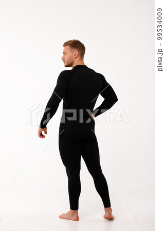 A man with a sporty physique in thermal underwear. A man with a sporty physique in thermal underwear. 99534009