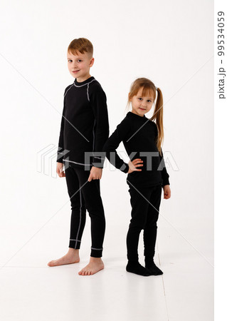 A little girl and her older brother in thermal clothes. A little girl and her older brother in thermal clothes. 99534059