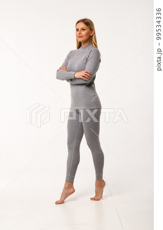 Sporty blonde girl in thermal clothing for women Sporty blonde girl in thermal clothing for women 99534336