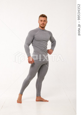 A man with a sporty physique in thermal underwear. A man with a sporty physique in thermal underwear. 99534352