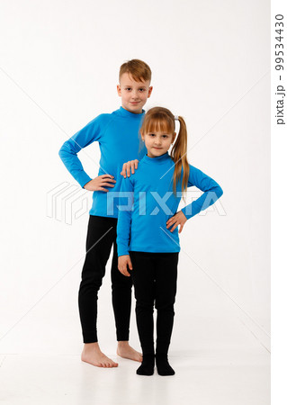 A little girl and her older brother in thermal clothes. A little girl and her older brother in thermal clothes. 99534430