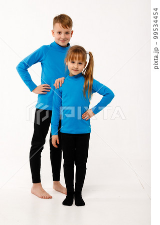 A little girl and her older brother in thermal clothes. 99534454
