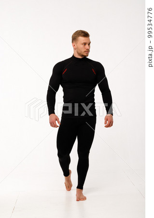 A man with a sporty physique in thermal underwear. A man with a sporty physique in thermal underwear. 99534776