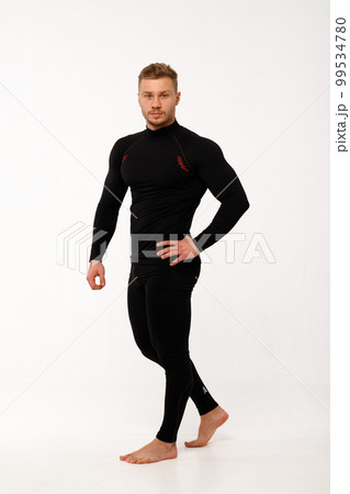 A man with a sporty physique in thermal underwear. A man with a sporty physique in thermal underwear. 99534780