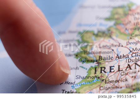 Finger pointing to Shannon, Ireland on colorful map with selective focus, shallow depth of field, background blur. High quality photo Finger pointing to Shannon, Ireland on colorful map with selective focus, shallow depth of field, background blur. High quality photo 99535845