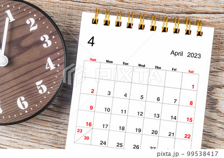The April 2023 Monthly desk calendar for 2023 year with clock. 99538417