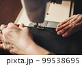 Woman working with sewing machine 99538695
