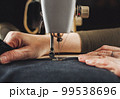 Woman working with sewing machine 99538696