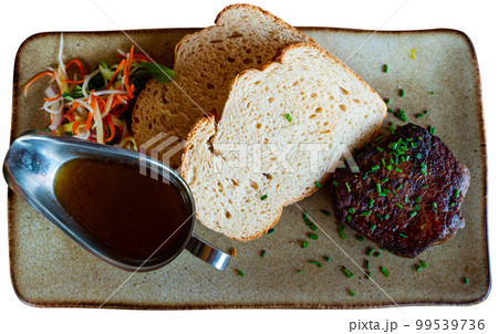 Rump steak served with bread, sauce, salad Rump steak served with bread, sauce, salad 99539736
