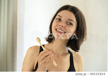 Young girl is cleaning her teeth. Young girl is cleaning her teeth. 99542834