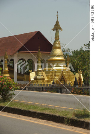 Outdoor Golden Pagoda at Wat Somdet, a historic site in Amphoe Sangkhlaburi, Kanchanaburi Province ,Middle of Thailand. A combination of Thai-Raman and Myanmar art.  99543596