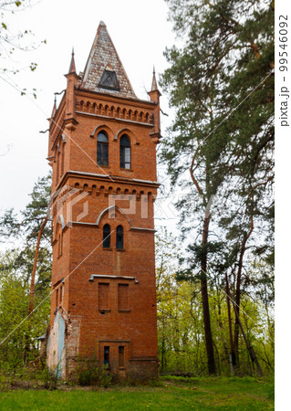 Old brick water tower in Natalyevka park in Kharkiv region, Ukraine 99546092