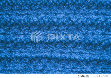 Handmade knit background with macro wool threads. 99549286