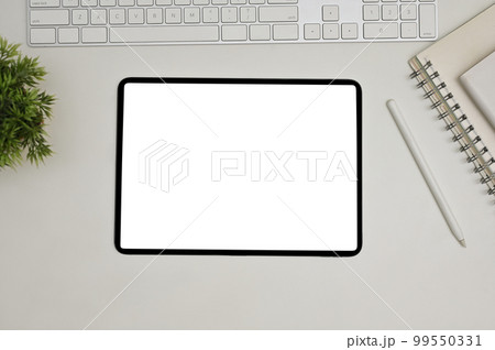 Modern workspace top view with keyboard, book, decor plant, stylus pen and digital tablet 99550331