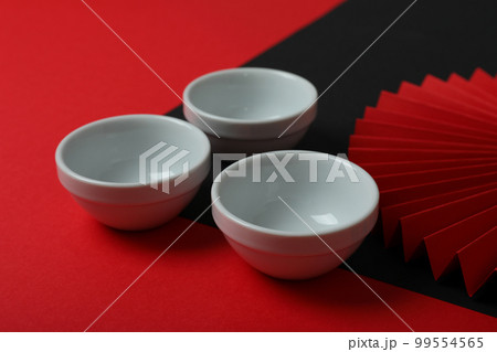 Concept of hot drink, asian tea accessories, isolated on white background  Stock Photo by AtlasComposer