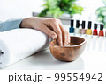 Closeup female hands in wooden bowl with water 99554942
