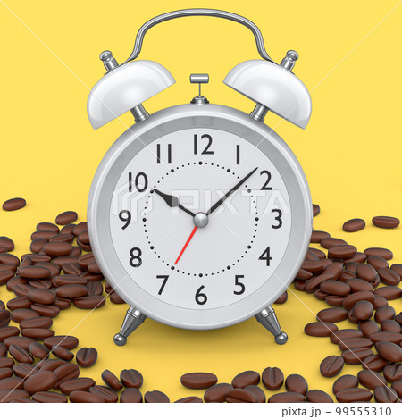 Vintage alarm clock with roasted coffee beans spread out on yellow background. 99555310