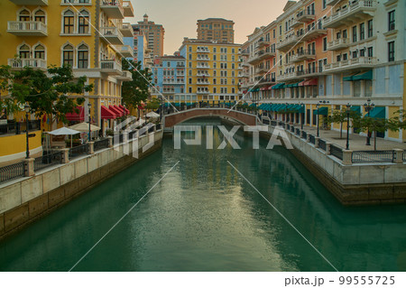 Qanat Quartier The pearl, Doha Qatar after noon shot showing the unique architecture of the building , water canals and visitors Qanat Quartier The pearl, Doha Qatar after noon shot showing the unique architecture of the building , water canals and visitors 99555725