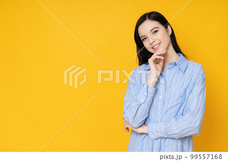 Beautiful young woman in shirt on yellow background Beautiful young woman in shirt on yellow background 99557168