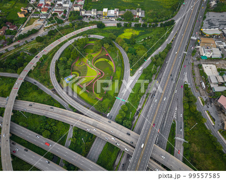 Aerial view city transport junction cross road with green public park transport industry Aerial view city transport junction cross road with green public park transport industry 99557585