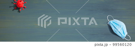 Surgical mask with influenza and Coronavirus concept 99560120