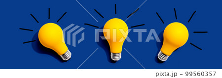 Three yellow light bulbs 99560357