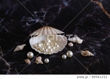 a few pearls in a sea shell a few pearls in a sea shell 99561252