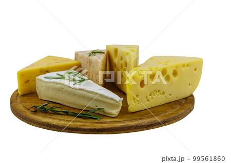 Set of various types of cheese on wooden cutting board isolated on white background Set of various types of cheese on wooden cutting board isolated on white background 99561860