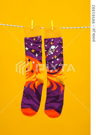 Concept of clothes for legs - socks, socks hanging on rope Concept of clothes for legs - socks, socks hanging on rope 99561992
