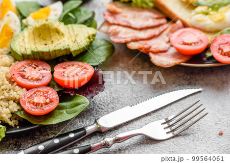Delicious healthy lunch consisting of chicken, avocado, quinoa, eggs, tomatoes 99564061