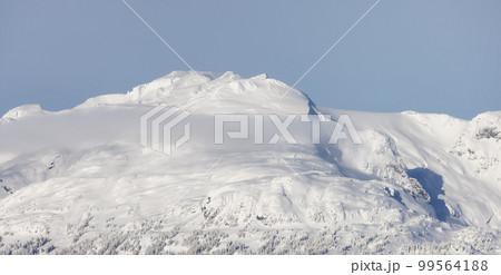 Snow and Cloud covered Canadian Nature Landscape Background. Whistler Snow and Cloud covered Canadian Nature Landscape Background. Whistler 99564188