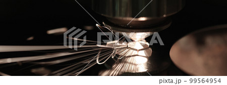 Sparks while cutting metal on black closeup Sparks while cutting metal on black closeup 99564954