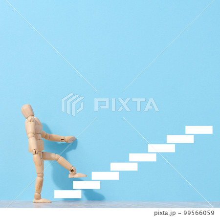 A wooden mannequin and drawn steps going up, a concept of achieving a goal, strong personality A wooden mannequin and drawn steps going up, a concept of achieving a goal, strong personality 99566059