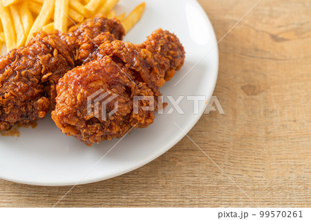 spicy Korean fried chicken with fries 99570261