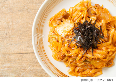 stir-fried udon noodles with kimchi and pork stir-fried udon noodles with kimchi and pork 99571664