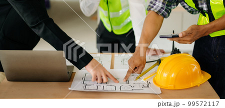 Engineer Teamwork Meeting, Drawing working on blueprint meeting for project working with partner on model building at company office. Asian industry professional team. Engineer Teamwork Meeting, Drawing working on blueprint meeting for project working with partner on model building at company office. Asian industry professional team. 99572117