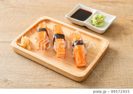 Crab Stick Sushi on wood plate Crab Stick Sushi on wood plate 99572935