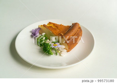 Basque Burnt Cheesecake on plate Basque Burnt Cheesecake on plate 99573180